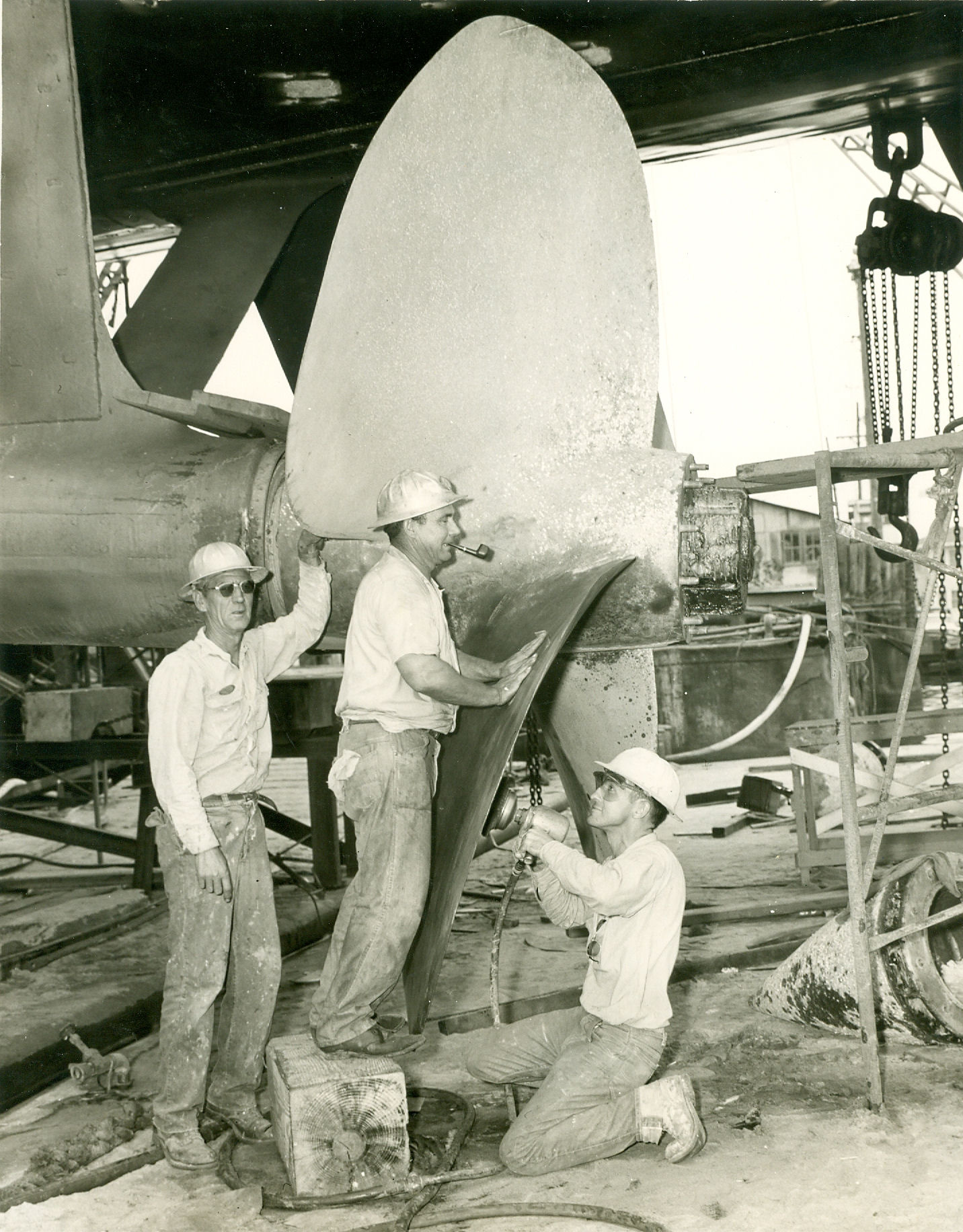 Haynsworth in Dry Dock, circa 1967. Orange, TX. Yard Birds fine tuning the screws.